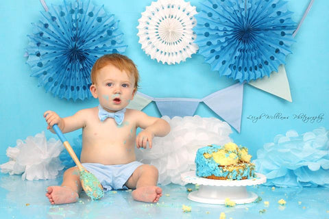 Baby boy bow tie and braces in cake smash birthday photo