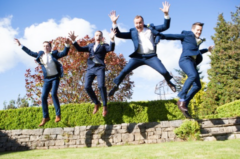 Wedding ushers in suits, ties and bow ties 