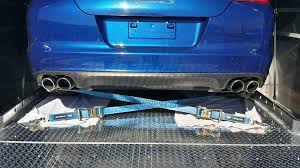Crossed Tie Down Straps at the Vehicle Rear Noting Proper Angles on 3 Planes