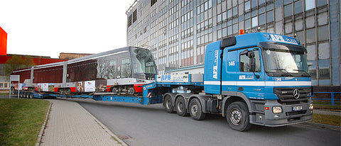 European Drop Deck hauling commuter train