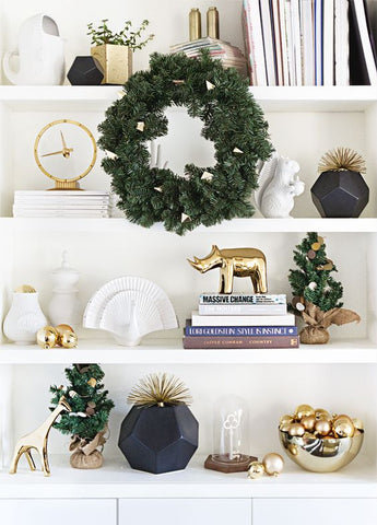 Wreath in front of a white book shelf