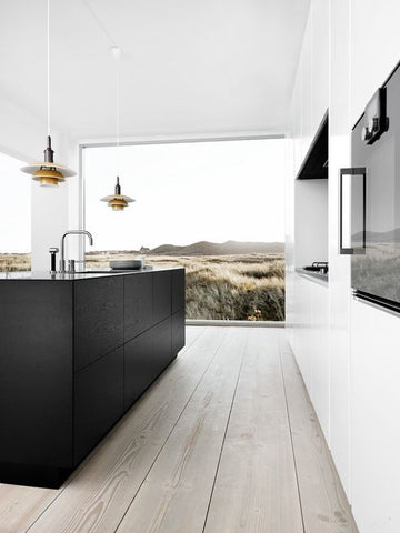 Minimalist kitchen with black and white cabinets