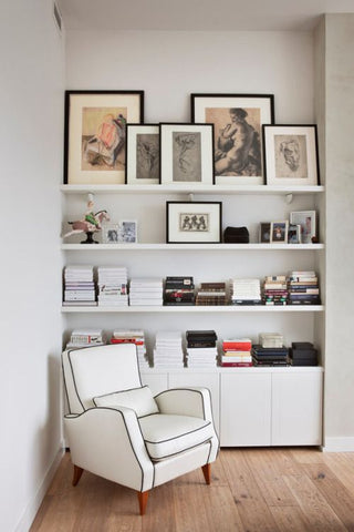 Layered artwork in a reading nook