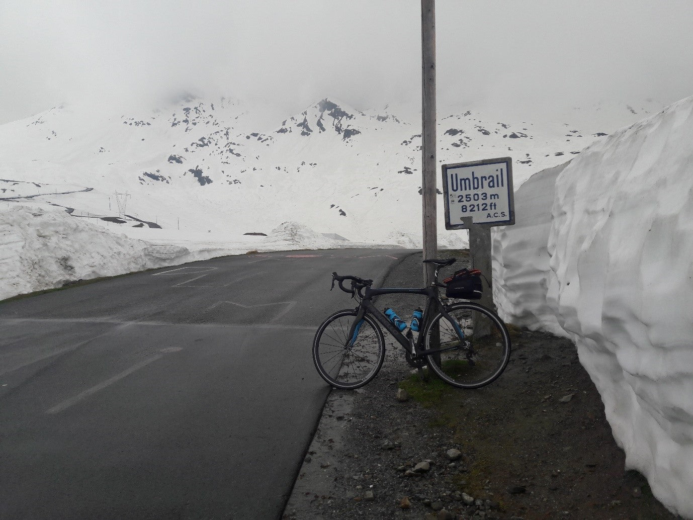 The top of the Umbrail pass. Note the road to the Stelvio summit on the left.