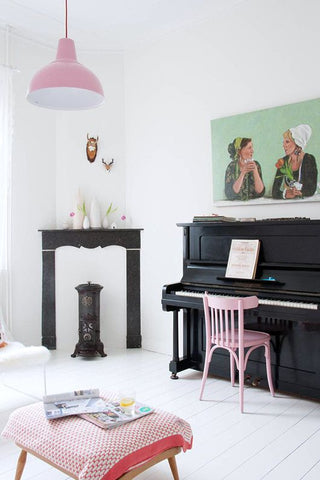 Pastels pink lamp and black piano