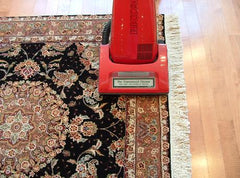 Vacuuming rugs