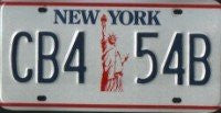New York State Statue of Liberty License Plate blue numbers on white with red Statue of Liberty
