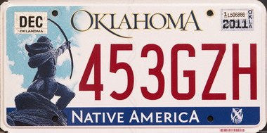 OK-104 Oklahoma Native America license plate red numbers on white with Native American shooting bow and arrow flat non-embossed