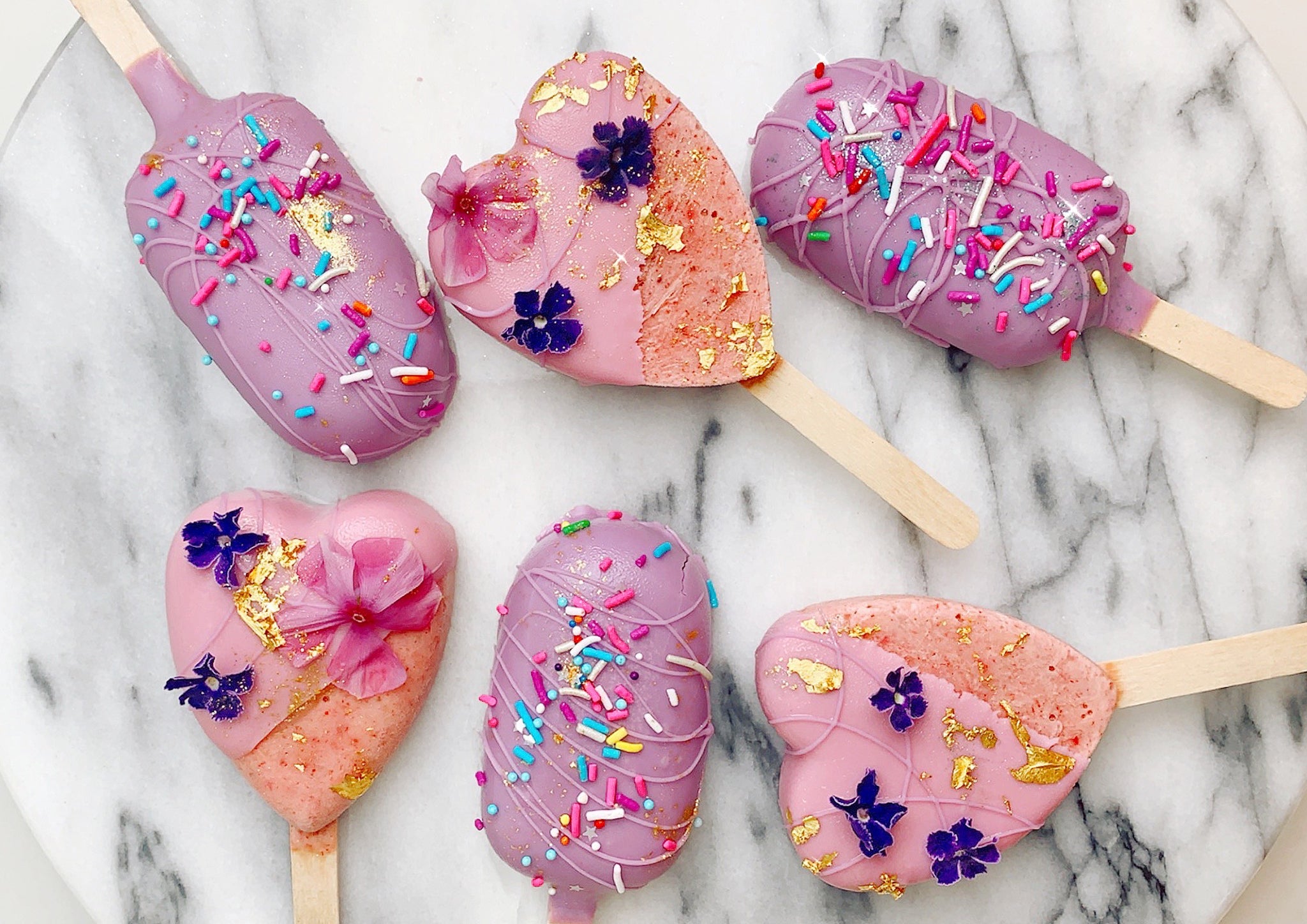 pink and purple frozen smoothie yogurt pops 