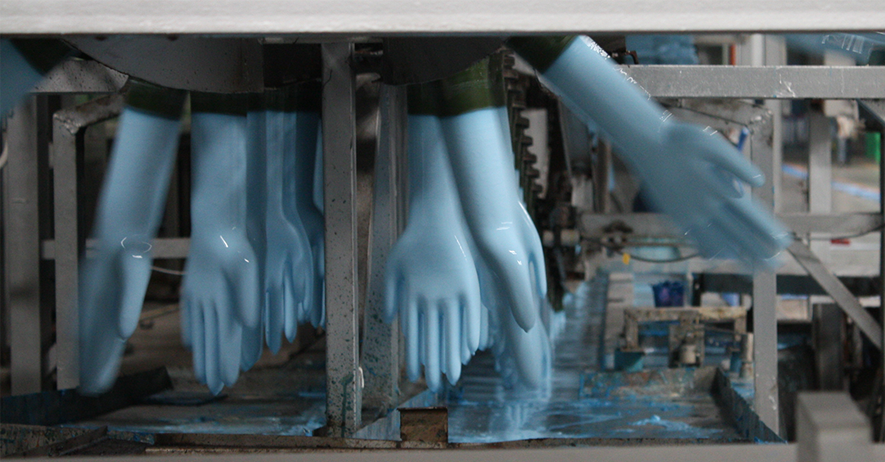 Glove Formers Being Dipped