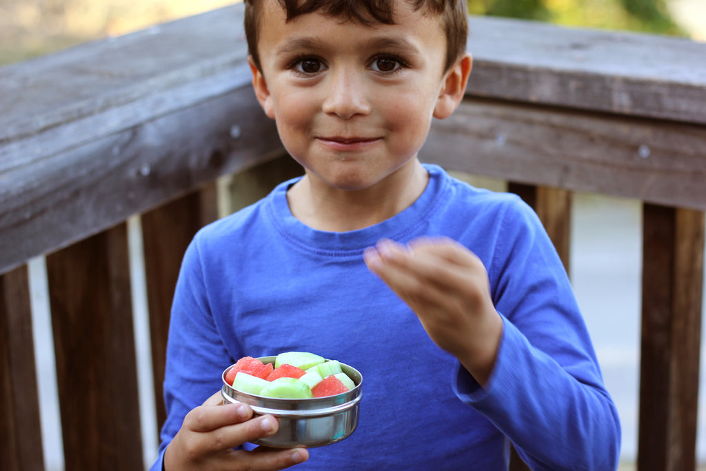 Boy Eating cucumber