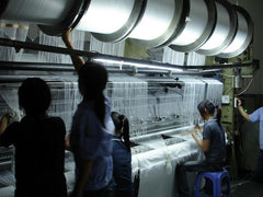 Weaving machine setup in microfiber production change over