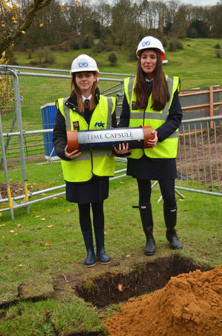 Pupils from Wycombe Abbey holding a Celebration time capsule - Time Capsules UK