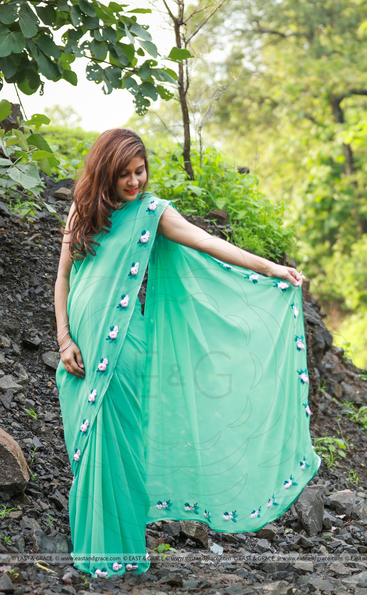 Baby Pink Rose Flowers on a Sea Green Pure Silk Georgette Saree