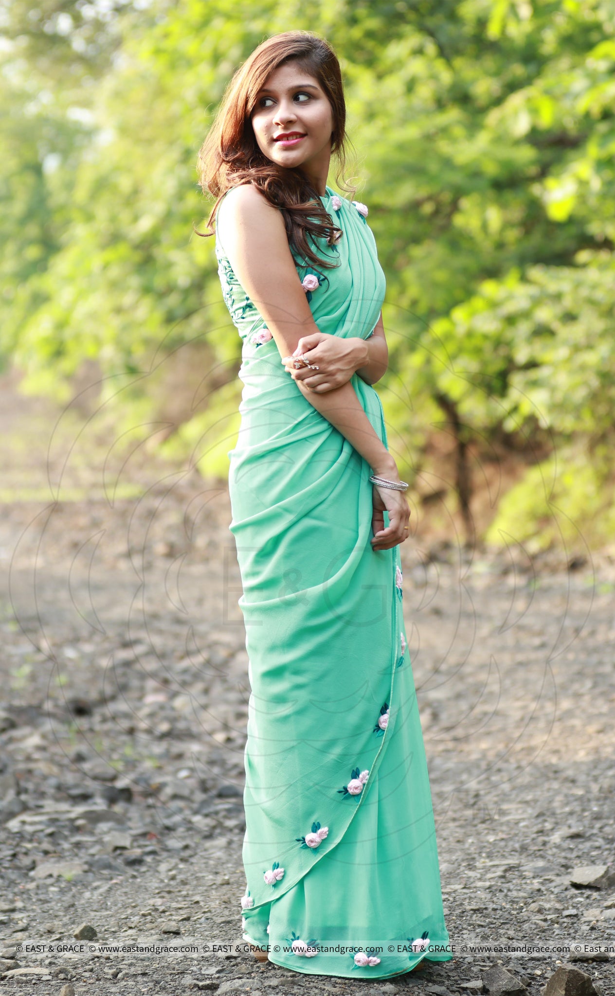 Baby Pink Rose Flowers on a Sea Green Pure Silk Georgette Saree