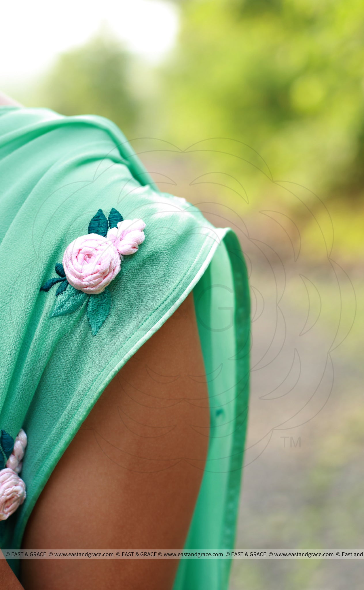 Baby Pink Rose Flowers on a Sea Green Pure Silk Georgette Saree