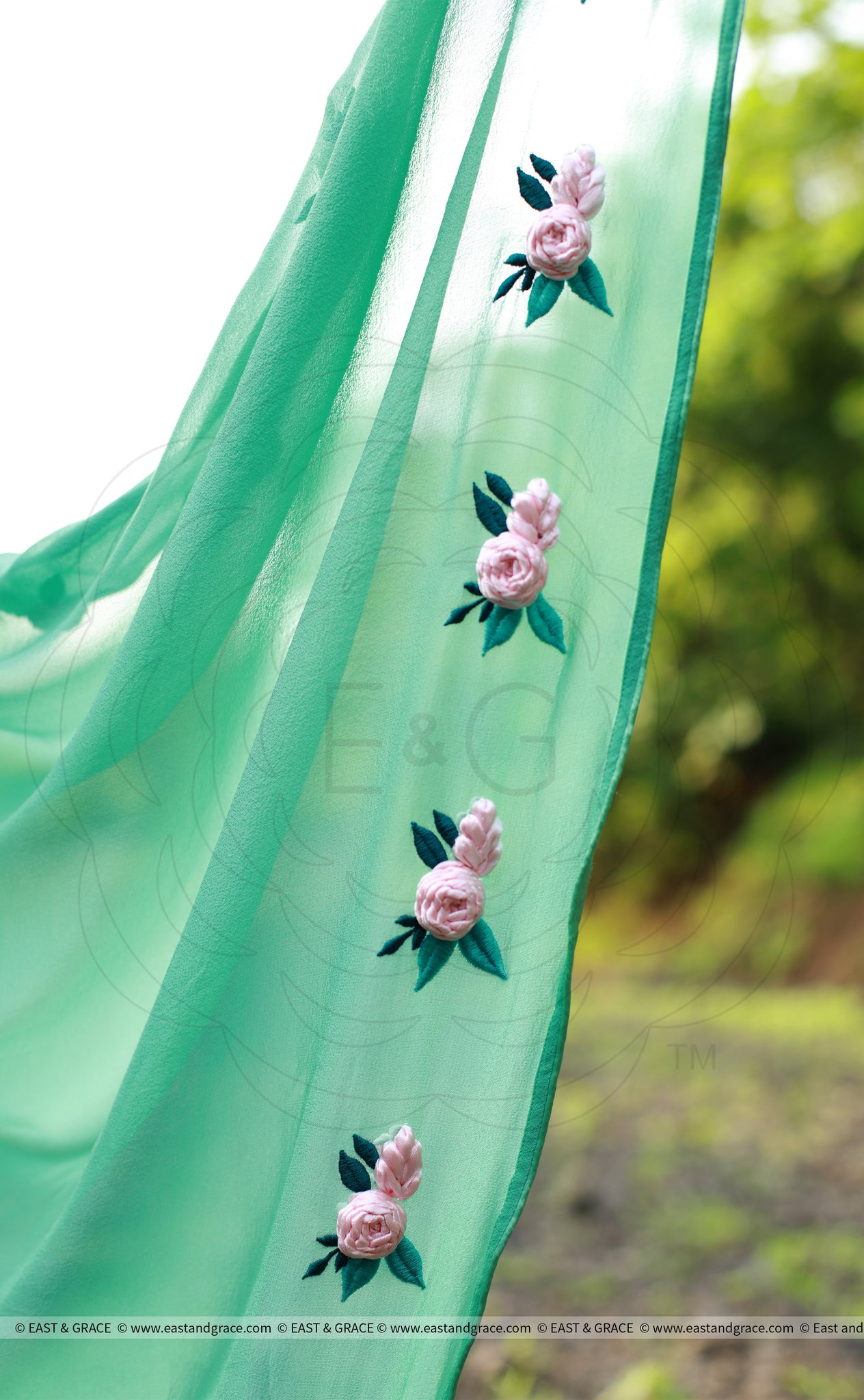 Baby Pink Rose Flowers on a Sea Green Pure Silk Georgette Saree