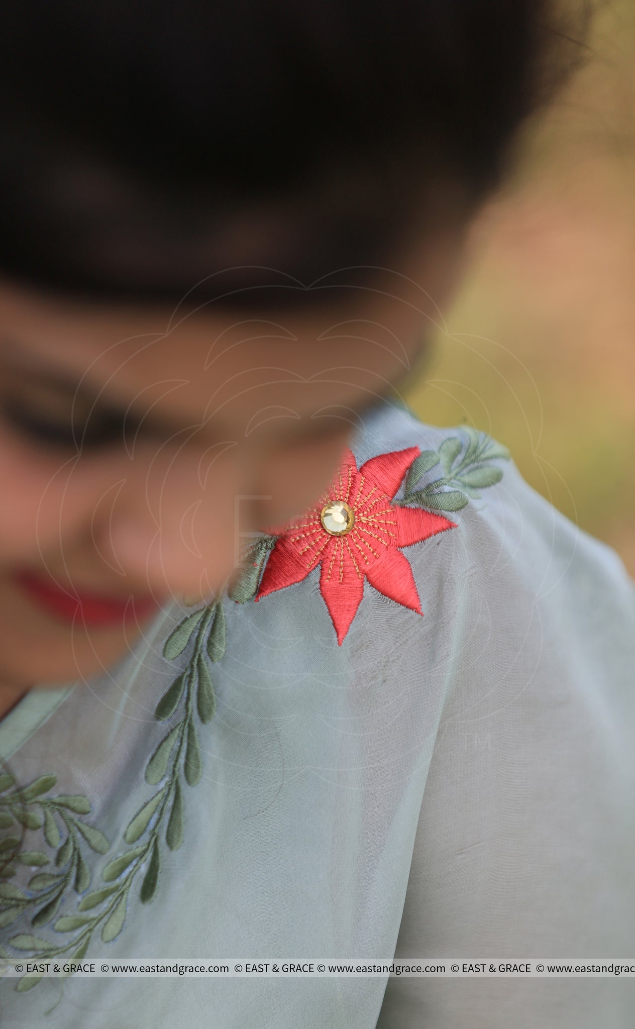 Sage Green Pure Georgette Saree with Embroidered Lilies