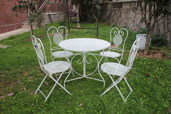 white metal outdoor table and chairs