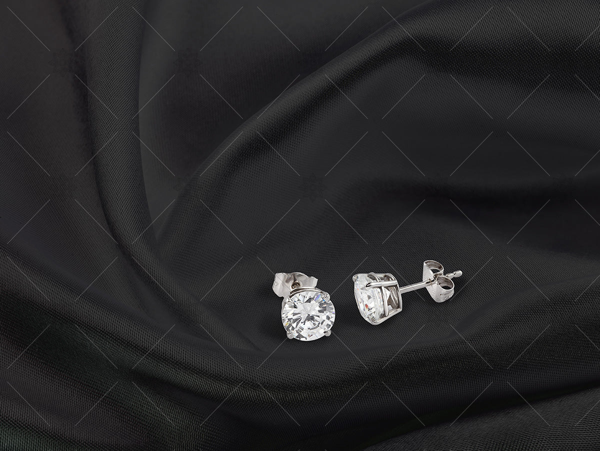 diamond stud earrings on black silk