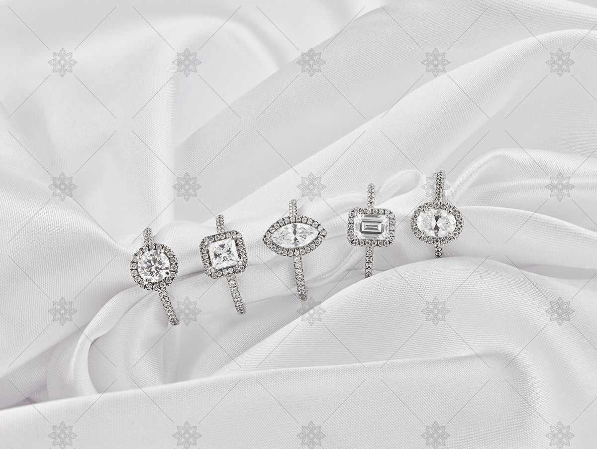 diamond cluster rings on white silk