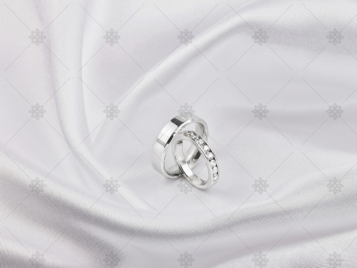 bride and groom ring on white silk