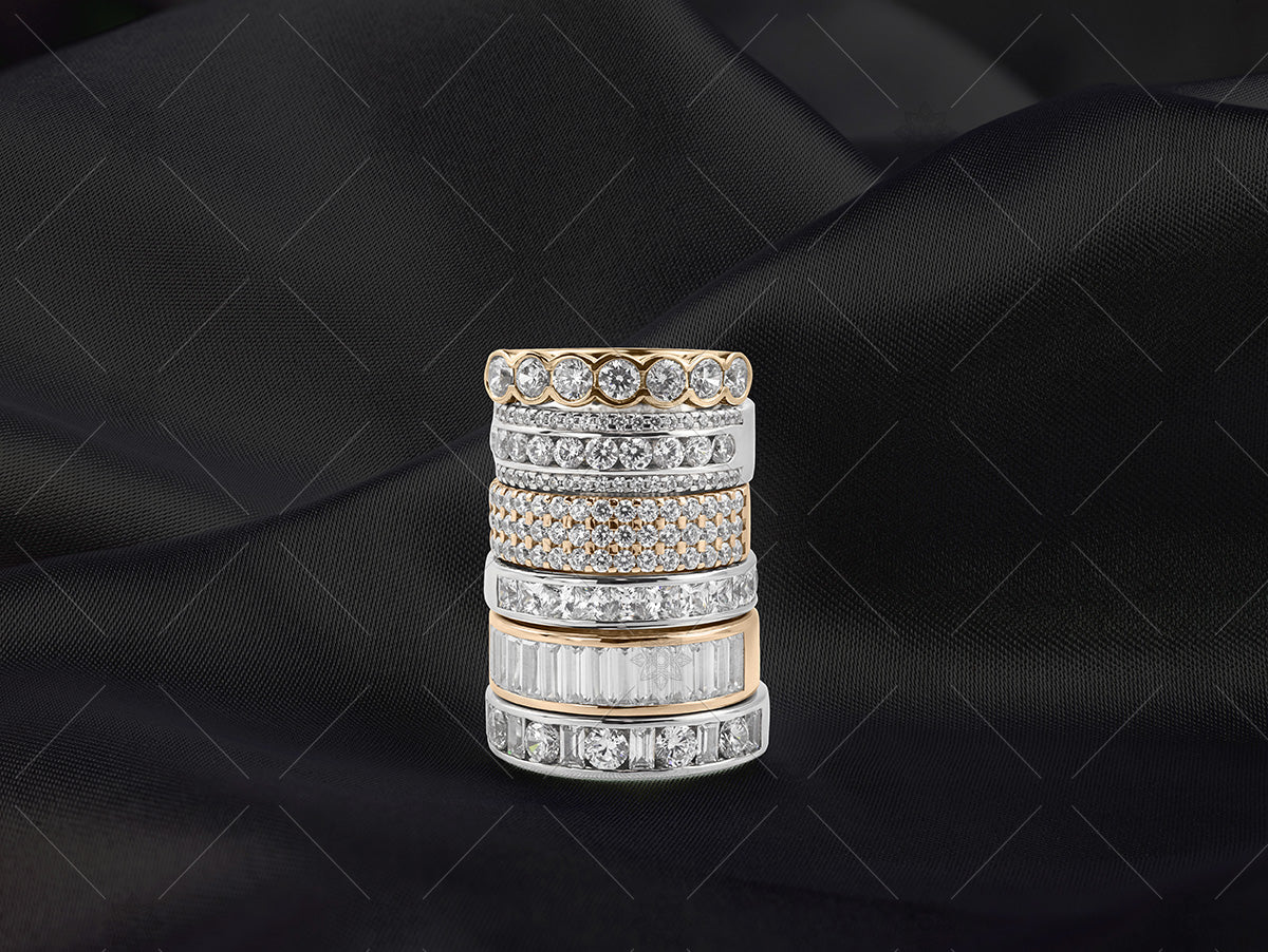 gold eternity ring stack on black silk