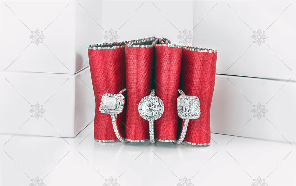 Red ribbon and diamond halo rings