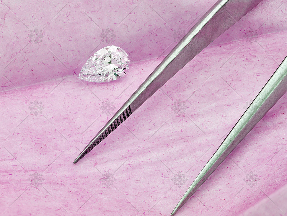 Pear cut diamond on Pink background