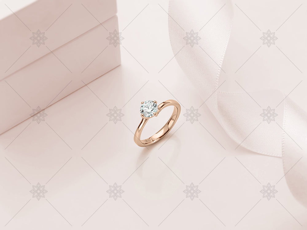 rose gold ring on tinted background