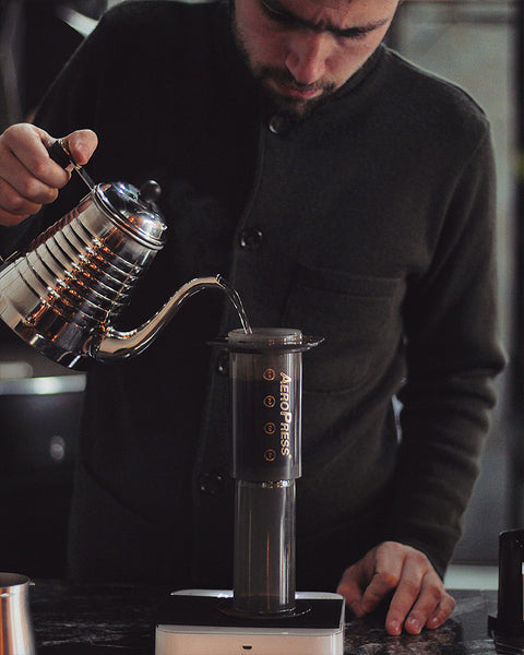 Add water to your Aeropress ground coffee