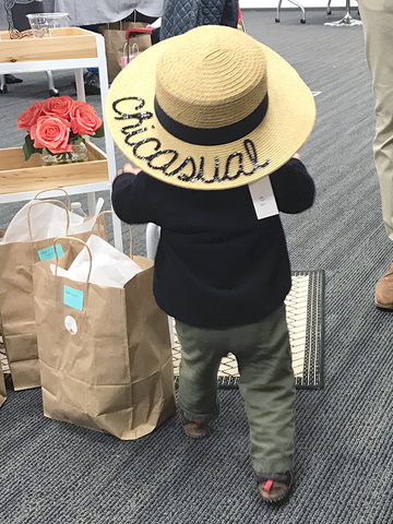A baby wearing our signature straw hat is as cute as it gets.  