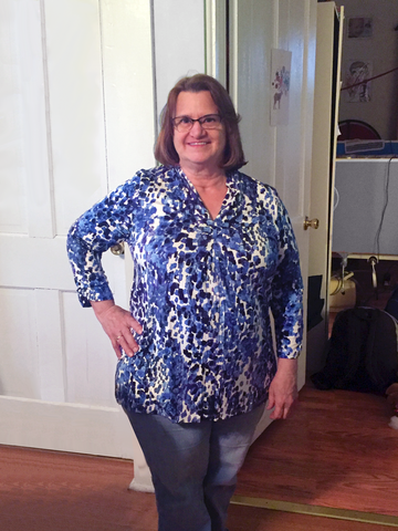 Our v-neck watercolor tunic with 3/4 sleeves is flattering on most body types. 