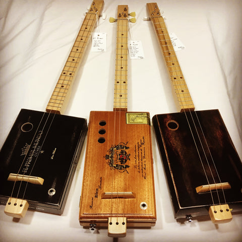 Cigar Box Guitars handmade by Mike Snowden in his shop Marietta GA USA.