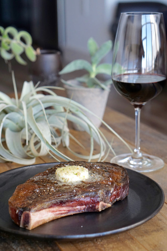 Steak with compound butter and red wine