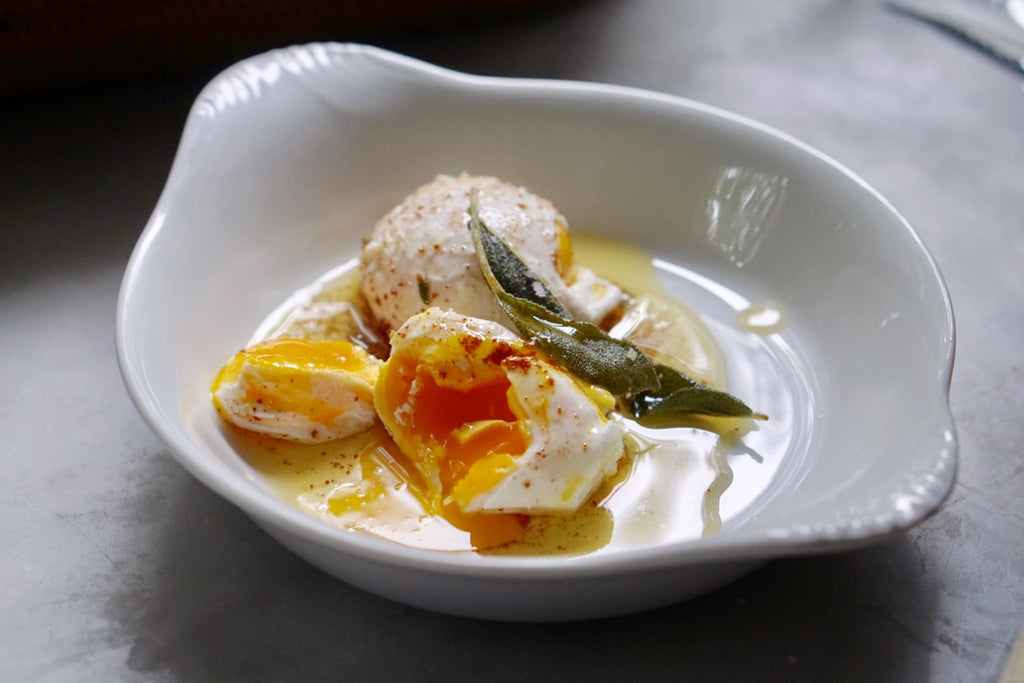 Poached eggs with browned butter and crispy sage