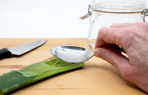 Scrape aloe vera gel with a spoon