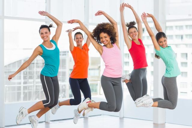 Exercises to Avoid If You Have Bad Knees: Women in a gym jumping.