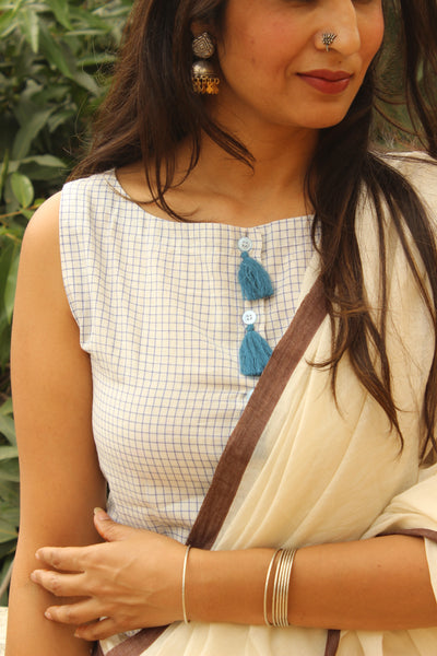White and Blue Checked Sleeveless ready to wear cotton Blouse with tassels .