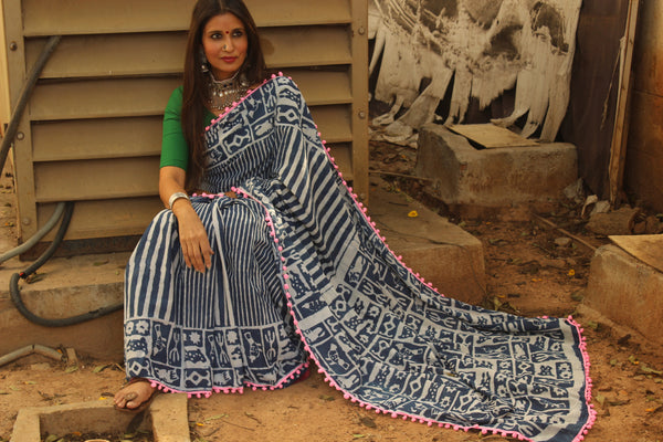 | Gulabi Chameli | Indigo hand block printed dabu saree with pompom border.