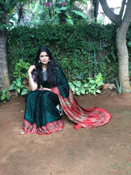 | Panna | Bottle Green vegetable dyed Ajrakh saree with bandhani in modal Silk.