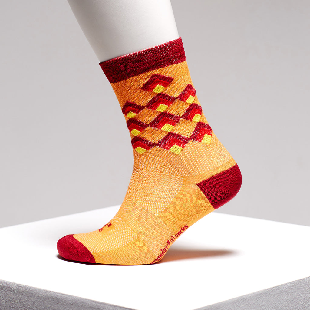 Red and orange colourful sports socks by The Wonderful Socks on Omnium