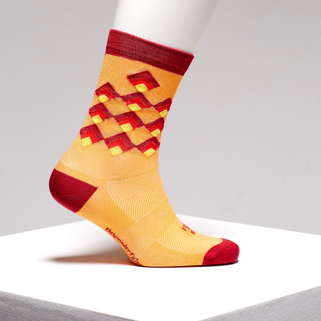 Red and orange colourful sports socks by The Wonderful Socks on Omnium