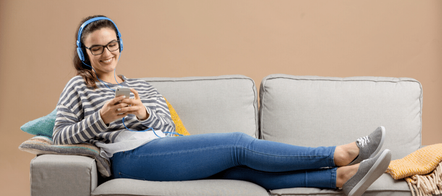 Woman relaxing at home with headphones during covid 19 quarantine