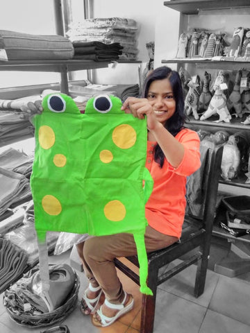 M.E.S.H Shop Dehli India, fairtrade hand made accessories the lovely Tina modelling a frog cushion visited April 2019