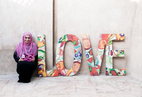 Sabeena Ahmed - The Little Fair Trade Shop UK & UAE models the totally bobbles pink fair trade bag with LOVE. 