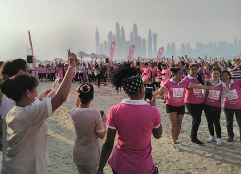 Pink Ladies on the beach participating in the Pink Ladies Games and the Pink Caravan UAE - October 21st 2016, Dubai UAE