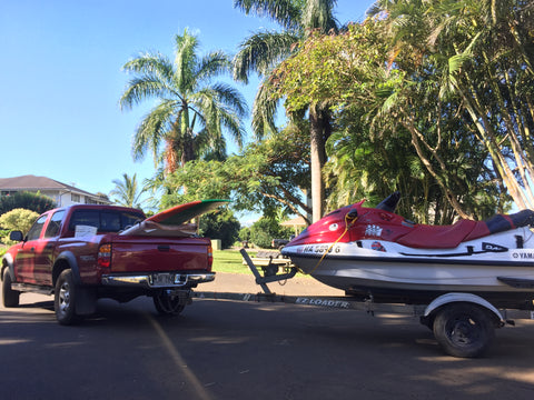 Jetski and pickup truck with surfboard in Hawaii