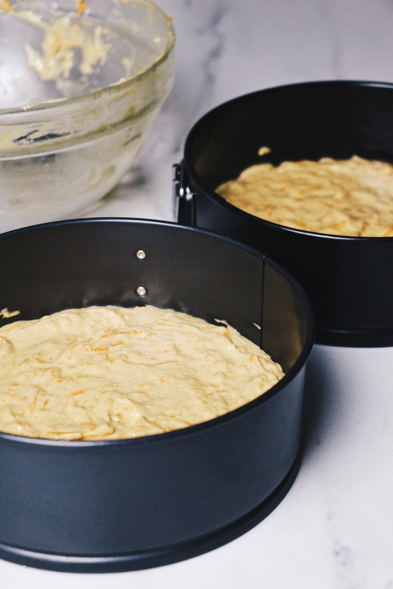 carrot cake batter in pans