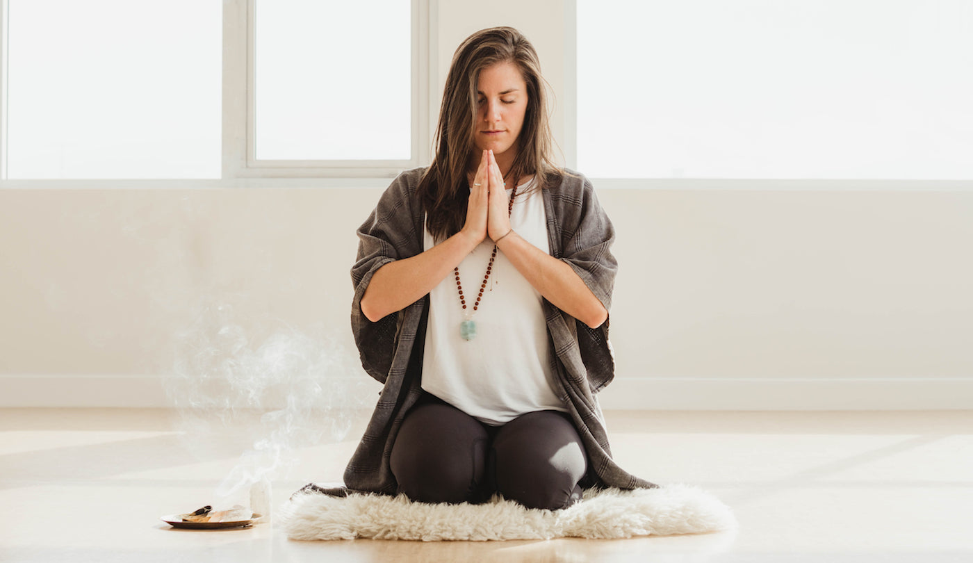 meditating with palo santo